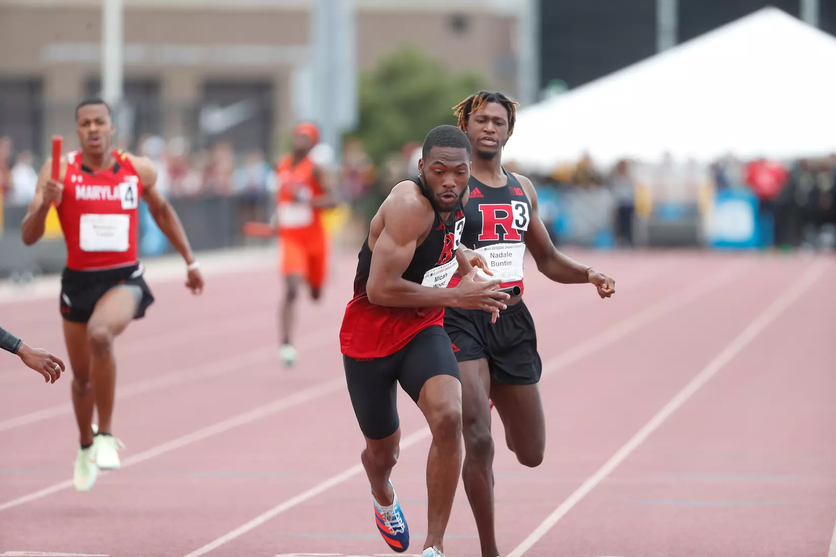 Micah Wood receives the baton from Nadale Buntin