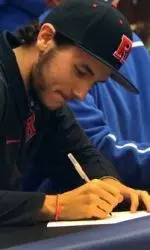 Reardon, pictured signing with Rutgers, pitched four shutout innings for the win.