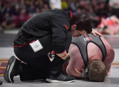 MINNEAPOLIS, MN - MARCH 09: Athletic trainer John Taggart attends to Christian Colucci during the 2019 Big Ten Wrestling Championships at Williams Arena in Minneapolis, Minnesota on March 9th, 2019. (Photo by Sam Wasson for Rutgers Athletics)