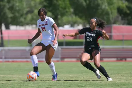 SchoefbergerALBUQUERQUE, NEW MEXICO - AUGUST 21: Naila Schoefberger #34 of the Rutgers Scarlet Knights dribbles against Cadence Whitley #29 of the UNLV Lady Rebels during their match. The Scarlet Knights defeated the Lady Rebels 5-1. (Photo by Sam Wasson for Rutgers Athletics)