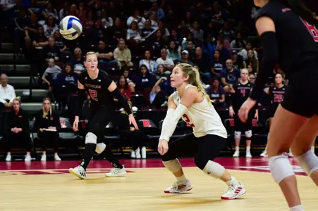Madyson Chitty digging the ball against #15 Penn State at Jersey Mike's Arena
