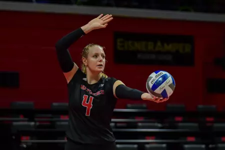 Lauren DeLo serving against No. 15 Penn State at Jersey Mike's Arena