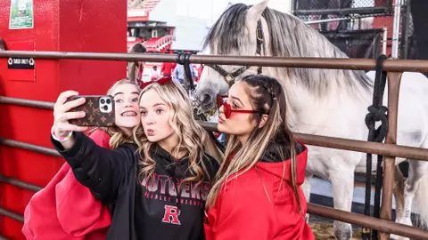 Rutgers football fans with horse
