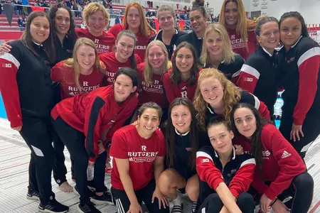 Rutgers Swimming & Diving on the pool deck following the Big Ten Championships