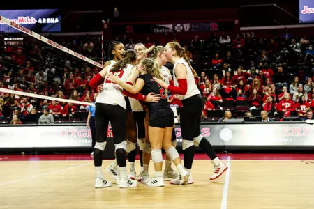 Rutgers Volleyball team huddle against Michigan