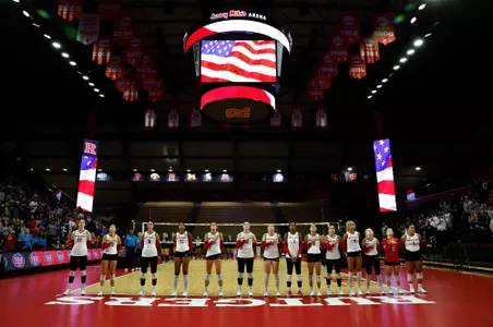 Rutgers volleyball lines up during the national anthem prior to its match with No. 19 Purdue