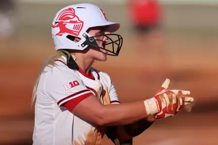 Payton Lincavage chopping during Rutgers softball's appearance at the Spring Games in 2022