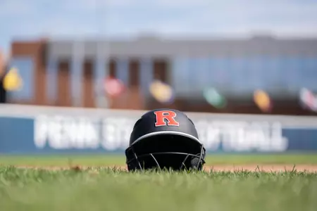 Rutgers softball helmet on the field at Penn State