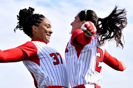 Morgan Smith and Taylor Lane chest bump during starting lineup during the Purdue series