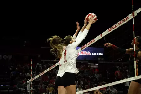 Rutgers' Anna Hartman and Natalie Robinson on the block against No. 16 USC at Jersey Mike's Arena