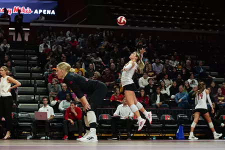 Lily Bolen on the serve in Rutgers volleyball's contest with No. 14 Minnesota at Jersey Mike's Arena