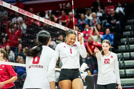 Zora Hardison celebrates a point with Alissa Kinkela looking on in Rutgers volleyball's match with Indiana at Jersey Mike's Arena
