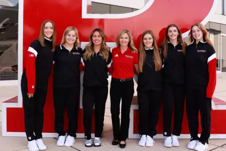 The Rutgers 2024-25 divers with head coach Natasha Chickina