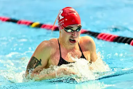 Molly Urkiel swims the breaststroke against Purdue at the Rutgers Aquatics Center