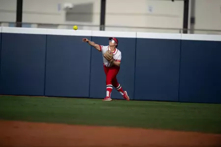 Kobie Hura making a throw in from right field in the Rutgers vs. No. 10 Duke softball game at the Panther Invitational