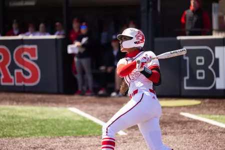 Morgan Smith swings during the Rutgers softball series with Wisconsin at the RU Softball Complex