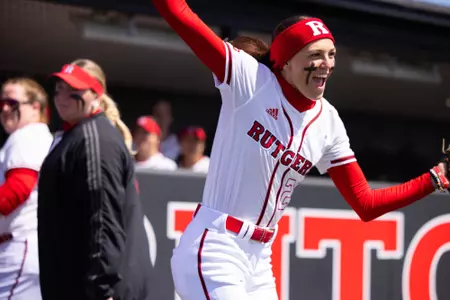 Kyleigh Sand cheers on her way out of the dugout during introductions during