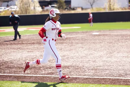 Morgan Smith on her way home after hitting her 15th home run of the year in a win over Wisconsin at the RU Softball Complex