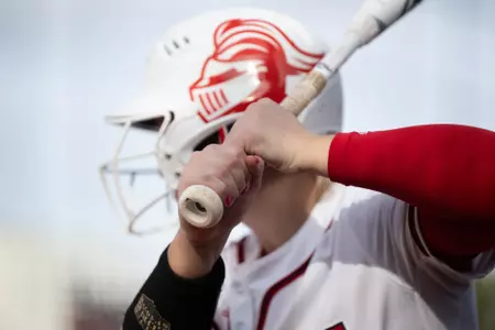 Close up of white batting helmet with Knighthead logo on Scarlet Knight batter