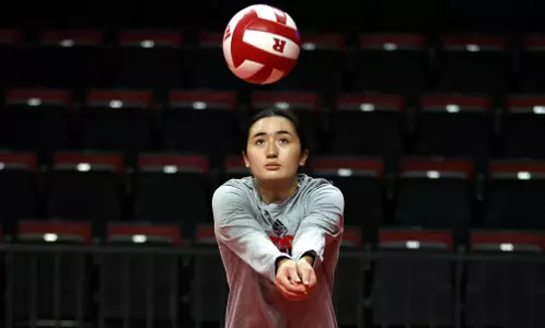 Lexi Visintine on a dig during warmups prior to Rutgers volleyball taking on Purdue at Jersey Mike's Arena in 2023