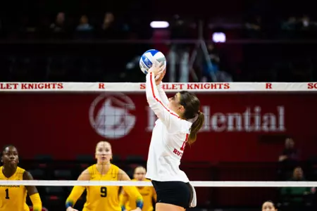 Lily Bolen sets the ball against Michigan