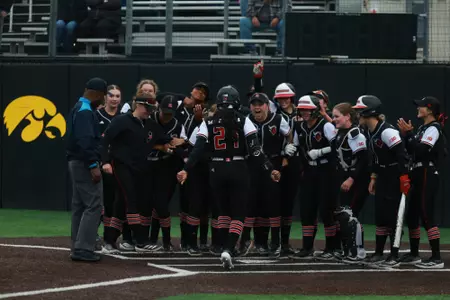 LA Matthews scores following her eighth home run of the season in the series opener with Iowa at Bob Pearl Field