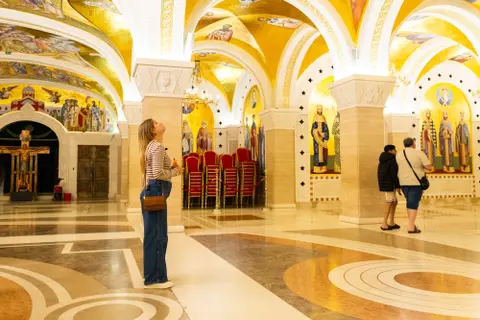 Alleigh Dutton looks at the ceiling at the Church of Saint Slava in Belgrade, Serbia