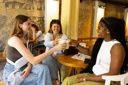 Natalie Robinson, Lily Bolen and Aspen Maxwell on a coffee break in Belgrade, Serbia