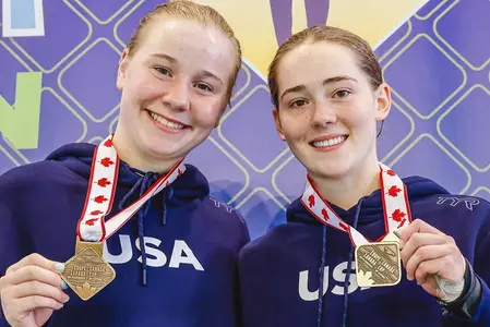 Bailee Sturgill and Katerina Hoffman posed with their gold medals for women's platform synchronized diving at the 2025 Canada Cup
