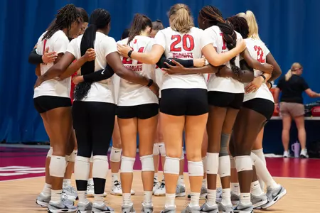 Rutgers volleyball huddles during its preseason scrimmage with Stony Brook