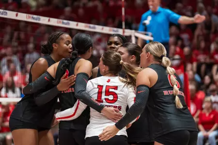 Rutgers volleyball huddles on the floor of the UW Fieldhouse during its match with No. 7 Wisconsin