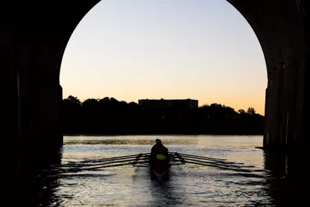 Rutgers Rowing goes underneath the Albany Street Bridge during 2025 fall practice on the Raritan River