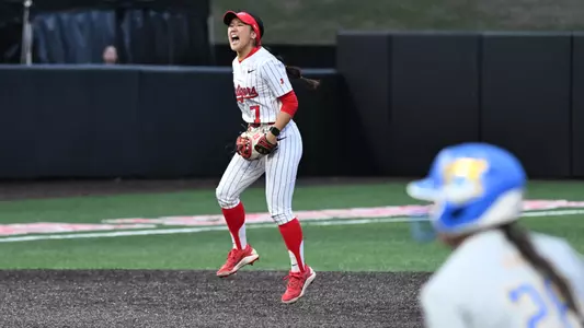 Riley Hwang celebrates at shortstop against #7 UCLA at the RU Softball Complex