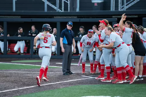 Addie Osborne reaches home plate after breaking the team season home run record in the series opener with Purdue at the RU Softball Complex