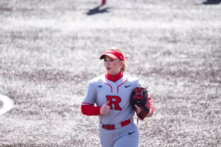 Baileigh Burtis runs off the field during Rutgers softball's home opener versus FDU