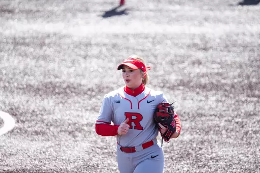 Baileigh Burtis runs off the field during Rutgers softball's home opener versus FDU