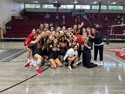 Rutgers volleyball celebrates following its win over Evansville