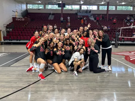 Rutgers volleyball celebrates following its win over Evansville