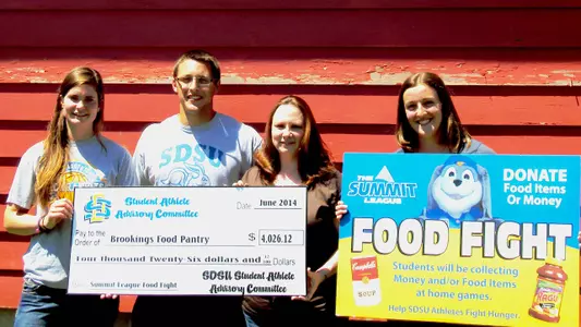 SDSU SAAC Presents check to Food Pantry