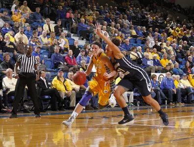 BROOKINGS, SD - NOVEMBER 14: Megan Waytashek #24 from South Dakota State University drives against Xojian Harry #11 from Brigham Young in the second half of their game Friday night at Frost Arena. (Photo by Dave Eggen/Inertia)