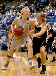 BROOKINGS, SD - JANUARY 11: Mariah Clarin #40 from South Dakota State University drives against Mikaela Shaw #22 from Omaha in the first half of their game Thursday night at Frost Arena in Brookings. (Photo by Dave Eggen/Inertia)