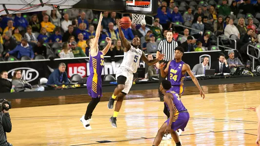 MINNEAPOLIS, MN - DECEMBER 1: David Jenkins #5 from South Dakota State University takes the ball to the basket against Spencer Haldeman #30 from University of Northern Iowa during their game at the US Bank Basketball Classic Saturday in Minneapolis, MN. (Photo by Dave Eggen/Inertia)