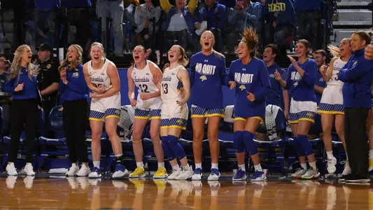South Dakota State celebrates on the bench during the WNIT Championship game