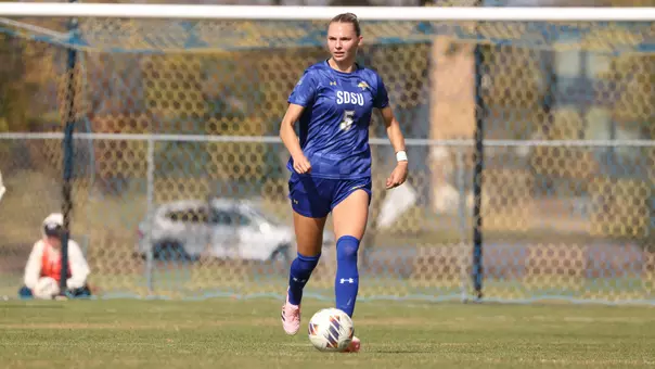 Taylor Thomas kicks a soccer ball in a game on October 12, 2025