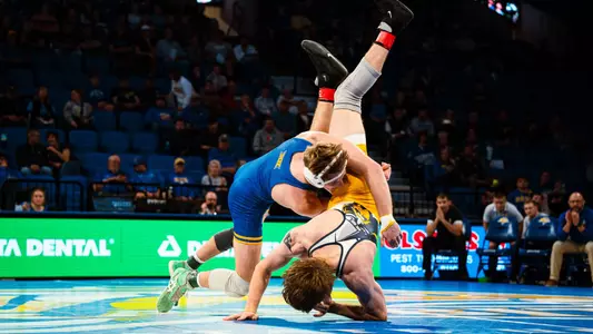 Cael Swensen takes down his opponent with a double leg shot against Kyle Boeke of Augustana