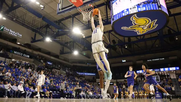Matthew Mors dunks a basketball in First Bank & Trust Arena
