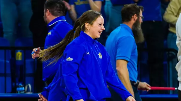 South Dakota State assistant coach Karly Berkland celebrates with
