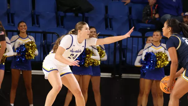 Maggie Hartwig defense against an Augustana player