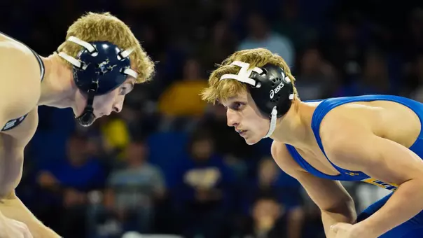 Brady Roark squares up with his opponent during a dual against Augustana at First Bank and Trust Arena