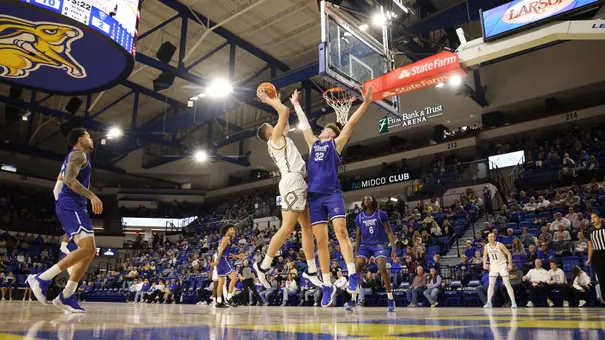 Damon Wilkinson goes up for a shot against a defender in First Bank & Trust Arena on November 21, 2025